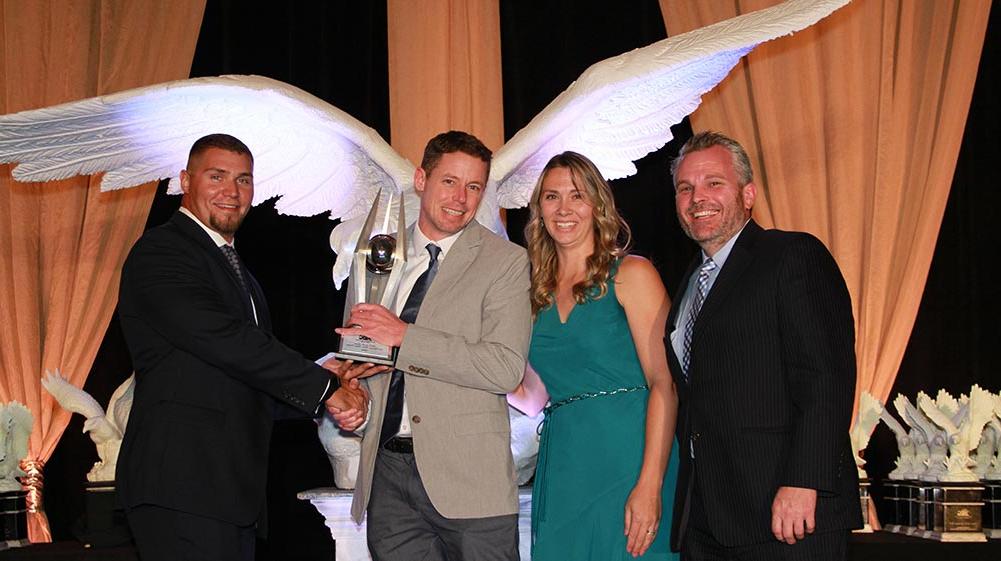 Project team posing with awards.