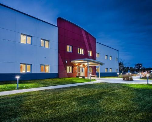 Nighttime photo of Cape Cod UPH building exterior