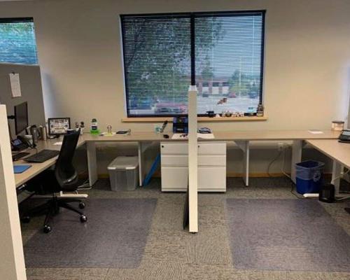 Shared cubicle in the Beloit office