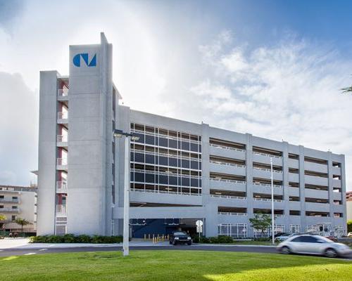 Exterior photo of parking garage on a sunny day.