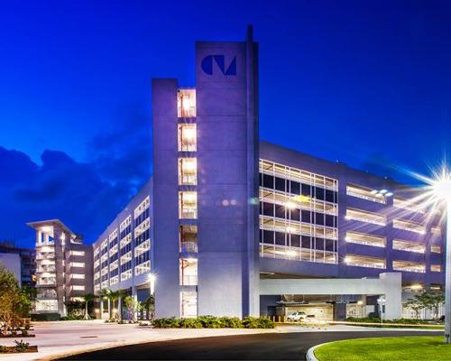 Exterior photo of parking garage at night.