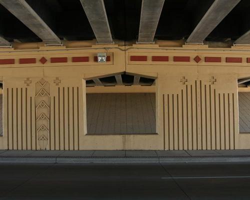 Detail of bridge piers beneath highway overpass